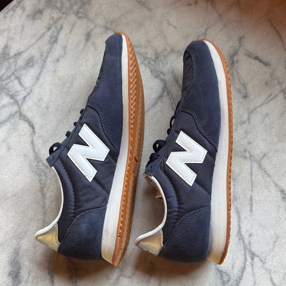 New Balance women’s Dark Blue and White Sneakers